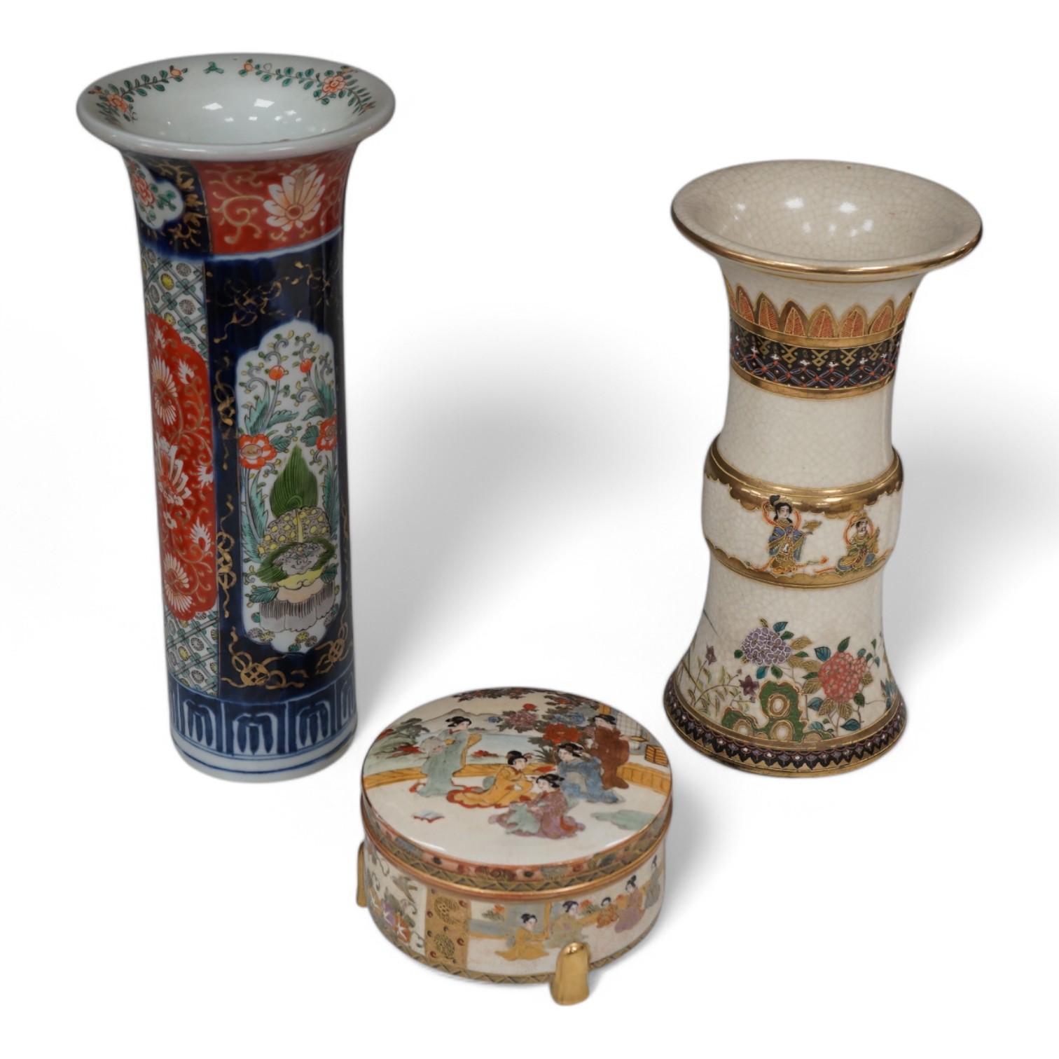 A Japanese Satsuma circular box and cover, a similar vase and an Imari sleeve vase, largest 30cm high. Condition - sleeve vase cracked, others good